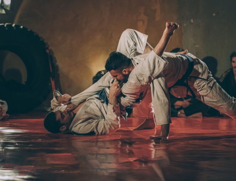 Brazilian Jiu Jitsu training for beginners practicing controlled grappling